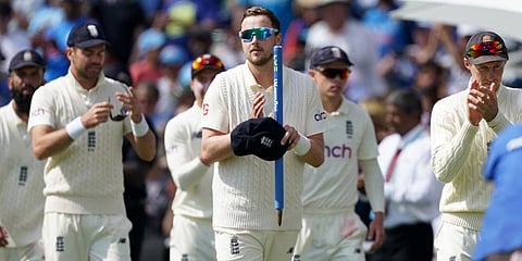 England's Ollie Robinson (c) and teammates walk off the field after their win on the fourth day of third test match against India, at Headingley cricket ground in Leeds. (Photo | AP)