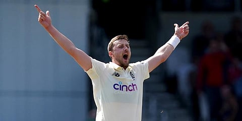 England's Ollie Robinson celebrates the dismissal of India's captain Virat Kohli during the fourth day of third Test match at Headingley cricket ground in Leeds. (Photo | AP)