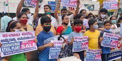 People form a human chain in Visakhapatnam to protest against the privatization of Vizag Steel. (Photo| EPS)