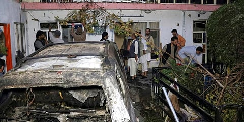 Afghan people are seen inside a house after US drone strike in Kabul, Afghanistan. (Photo | AP)