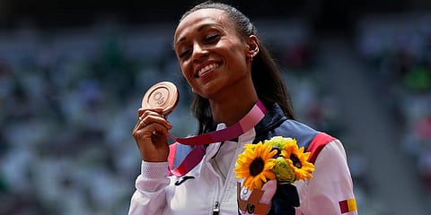 Ana Peleteiro, of Spain, holds up her bronze medal for the women's triple jump at the 2020 Summer Olympics in Tokyo. (Photo | AP)