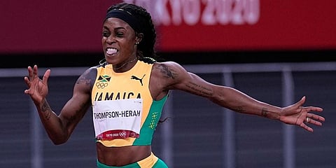 Elaine Thompson-Herah, of Jamaica, wins the women's 200-meter final at the 2020 Summer Olympics in Tokyo. (Photo | AP)