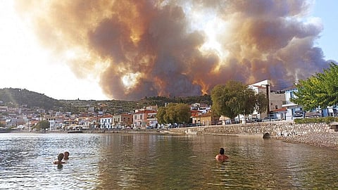 Flames burn on the mountain near Limni village on the island of Evia, about 160 kilometers (100 miles) north of Athens, Greece, Tuesday, Aug. 3, 2021. (Photo | AP)