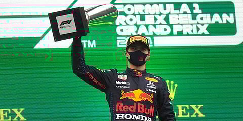 First place, Red Bull driver Max Verstappen of the Netherlands, holds up the trophy on the podium after the Formula One Grand Prix at the Spa-Francorchamps racetrack in Spa, Belgium. (Photo | AP)