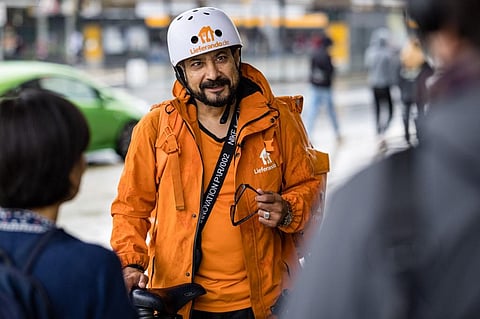 Sayed Sadaat, minister in Afghanistan from 2016 to 2018, quit, fed up with the corruption. Now in Germany, he is making a living delivering meals as a bicycle courier. (Photo | AFP)