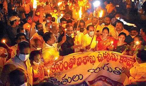 Torch light rally being taken out by Visakha Ukku Parirakshana Porata Committee in Vizag on Monday. (Photo | EPS/G Satyanarayana)