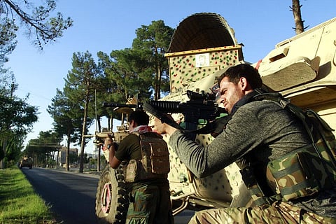 Afghan security personnel take a position during fighting between Taliban and Afghan security forces in Herat province, west of Kabul, Afghanistan (Photo | AP)