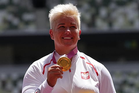 Gold medalist Anita Wlodarczyk, of Poland, poses during the medal ceremony for the women's hammer throw at the 2020 Summer Olympics. (Photo | AP)