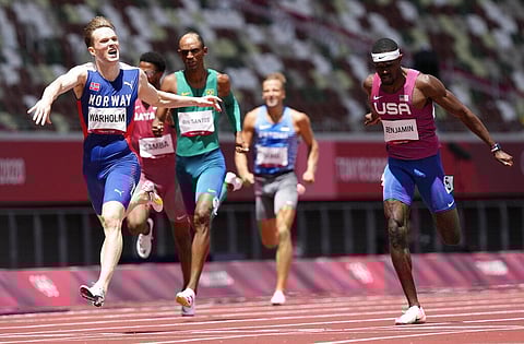 Karsten Warholm, of Norway celebrates as he wins the gold medal ahead of Rai Benjamin, of United States in the final of the men's 400-meter hurdles. (Photo | AP)