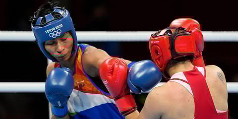Lovlina Borgohain, of India (L) and Busenaz Surmeneli, of Turkey, exchange punches during their women's welterweight 64-69kg semis boxing match at the 2020 Olympics in Tokyo, Japan. (Photo | AP)