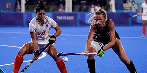 Argentina's Delfina Merino, right, and India's Udita, left, vie for the ball during a women's field hockey semi-final match at the 2020 Summer Olympics in Tokyo, Japan. (Photo | AP)