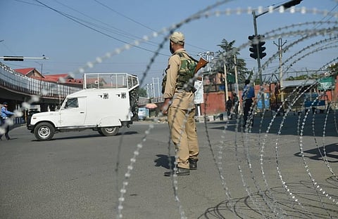 Security personnel stand guard on a street during restrictions imposed in the wake of the first anniversary of Article 370 abrogation in Srinagar Wednesday. (File Photo | PTI)