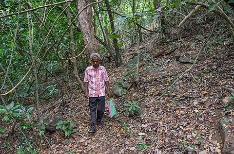 Postmaster Christuraja travels about 15 km to deliver the pension. (Photo | V Karthikalagu, EPS)