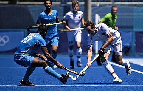 Germany's Niklas Wellen (R) is tackled by India's Amit Rohidas during men's bronze medal match Tokyo Olympics field hockey competition, at Oi Hockey Stadium, on August 5, 2021. (Photo | AFP)