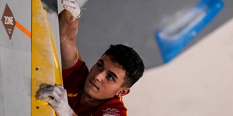 Alberto Gines Lopez, of Spain, competes during the bouldering portion of the men's sport climbing final at the 2020 Summer Olympics in Tokyo, Japan. (Photo | AP)