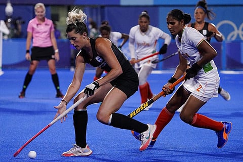 Argentina's Agustina Albertarrio, left, drives the ball past India's Gurjit Kaur, right, during a women's field hockey semi-final match at the 2020 Summer Olympics. (Photo | AP)