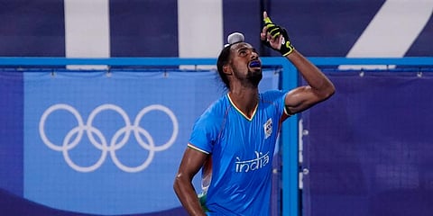 India's Hardik Singh celebrates after scoring during a men's field hockey match at the 2020 Summer Olympics in Tokyo, Japan. (Photo | AP)
