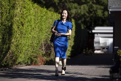 Meng Wanzhou, chief financial officer of Huawei, leaves home to attend her extradition hearing at B.C. Supreme Court, in Vancouver. (Photo | AP)