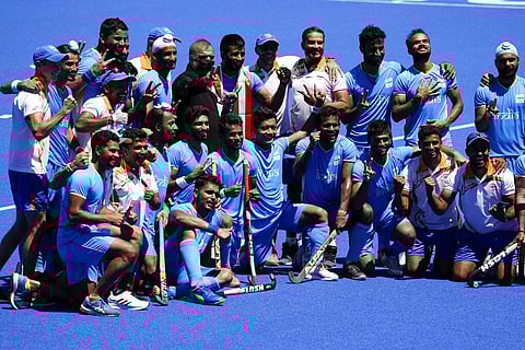 Members of the India team pose for photographs after defeating Germany 5-4 during the men's field hockey bronze medal match at the 2020 Summer Olympics. (Photo | AP)