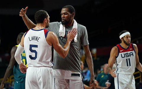 United States's Kevin Durant (7), center, celebrates with teammate Zachary Lavine (5) after their win in the men's basketball semifinal game against Australia. (Photo | AP)