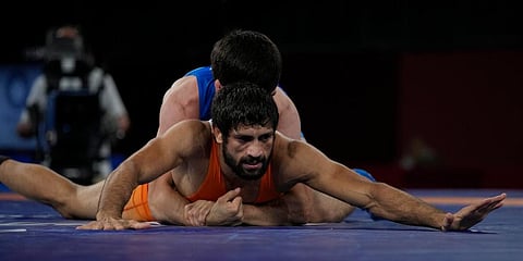 India's Ravi Dahiya and Russian Olympic Committee Zavur Uguev compete during the men's 53kg Freestyle wrestling final match at the 2020 Summer Olympics in Tokyo, Japan. (Photo | AP)