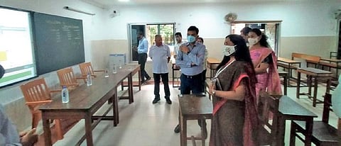 Mo School Abhiyan chairperson Susmita Bagchi, BSCL CEO Sanjay Singh and other officials at Unit-IX Girls High School in Bhubaneswar on Wednesday