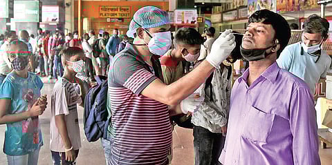 A healthcare worker collects swab samples for Covid-19 testing in Delhi on Thursday (Photo | Parveen Negi, EPS)