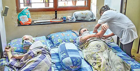 Elderly persons get the shot during a door-to-door vaccination drive in Mumbai | PTI