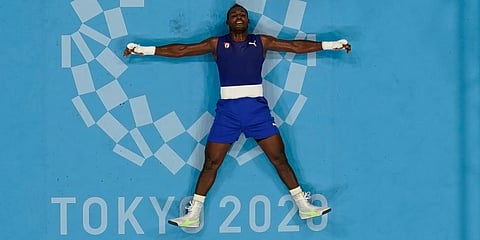 Cuba's Julio Cesar La Cruz reacts after beating Muslim Gadzhimagomedov of the Russian Olympic Committee, at the 2020 Summer Olympics in Tokyo, Japan. (Photo | AP)