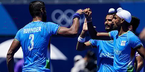 India's Rupinder Pal Singh (L) reacts with teammates after scoring on a penalty stroke against Germany during the hockey bronze medal match at the 2020 Olympics in Tokyo. (Photo| AP)