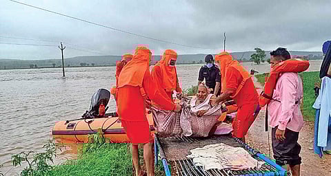 NDRF personnel rescuing an elderly woman from one of the flood affected districts of Gwalior-Chambal region of Madhya Pradesh.