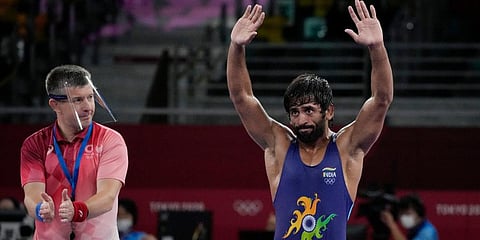 India's Bajrang Punia celebrates after defeating Kazakhstan's Daulet Niyazbekov during their men's freestyle 65kg wrestling bronze medal match at the 2020 Olympics in Chiba, Japan. (Photo | AP)