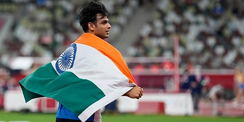 Neeraj Chopra, of India, celebrates after winning the men's javelin throw at the 2020 Summer Olympics, Saturday, Aug. 7, 2021, in Tokyo. (Photo | AP)
