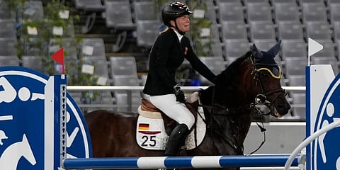 Annika Schleu of Germany cries as she couldn't controls her horse to compete in the equestrian portion of the women's modern pentathlon at the 2020 Summer Olympics in Tokyo, Japan. (Photo | AP)