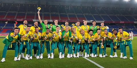 Players of Brazil pose with their gold medals after defeating Spain in the men's soccer final match at the 2020 Summer Olympics in Yokohama, Japan. (Photo | AP)