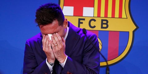 Lionel Messi cries at the start of a press conference at the Camp Nou stadium in Barcelona, Spain. (Photo | AP)