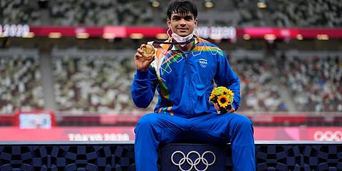 Gold medalist Neeraj Chopra, of India, poses during the medal ceremony for the men's javelin throw at the 2020 Olympics (Photo | AP)