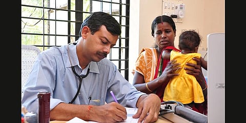 Dr V Narayanan attends to a patient at the SVMM hospital in Agali.