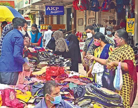 Street vendors selling clothes at Marine Drive. Identified street vendors will start getting identity cards from Friday | Albin Mathew