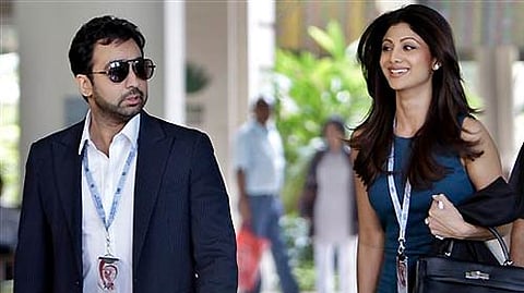 Bollywood actor Shilpa Shetty (R) and her husband Raj Kundra.