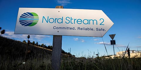 A road sign directs traffic towards the Nord Stream 2 gas line landfall facility entrance in Lubmin, north eastern Germany. (File photo| AFP)