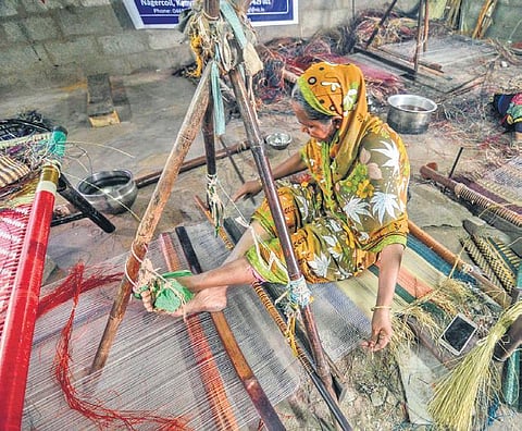 A woman weaving a Korai grass mat at Pattamadai in Tirunelveli | V KART HIKALAGU