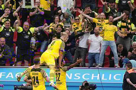 Dortmund's Jude Bellingham and Erling Haaland celebrate a goal during Bundesliga match against Bayer Leverkusen on Saturday. (Photo | AP)