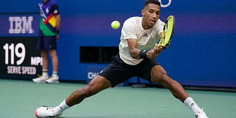 Felix Auger-Aliassime returns a shot to Daniil Medvedev during the semifinals of the US Open tennis championships in New York. (Photo | AP)