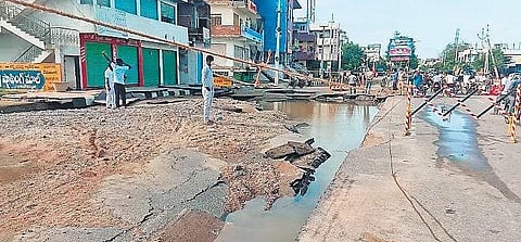 A road marred by potholes in Sircilla, on Thursday, following heavy rains that lashed the town for a couple of days