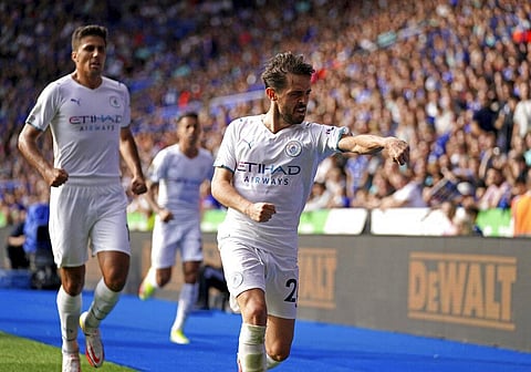 Manchester City's Bernardo Silva celebrates scoring their side's first goal during Premier League match at The King Power Stadium, Leicester, on Saturday. (Photo | AP)