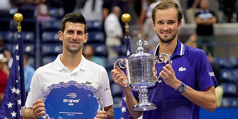 Daniil Medvedev (R) and Novak Djokovic pose for photos after the men's singles final of the US Open tennis championships in New York. (Photo | AP)