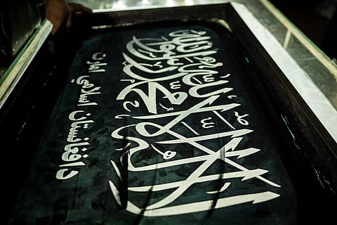 A worker hand prints Taliban flags in a small workshop in Kabul's Jawid market, Afghanistan, Sunday, Sept. 12, 2021. (Photo | AP)