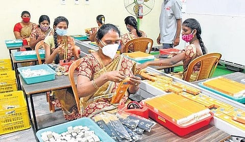 Workers making agarbatti in Tirupati on Monday. (Photo | Madhav)