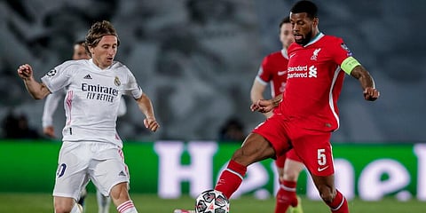 Liverpool's Georginio Wijnaldum (R) controls the ball. (File Photo | AP)